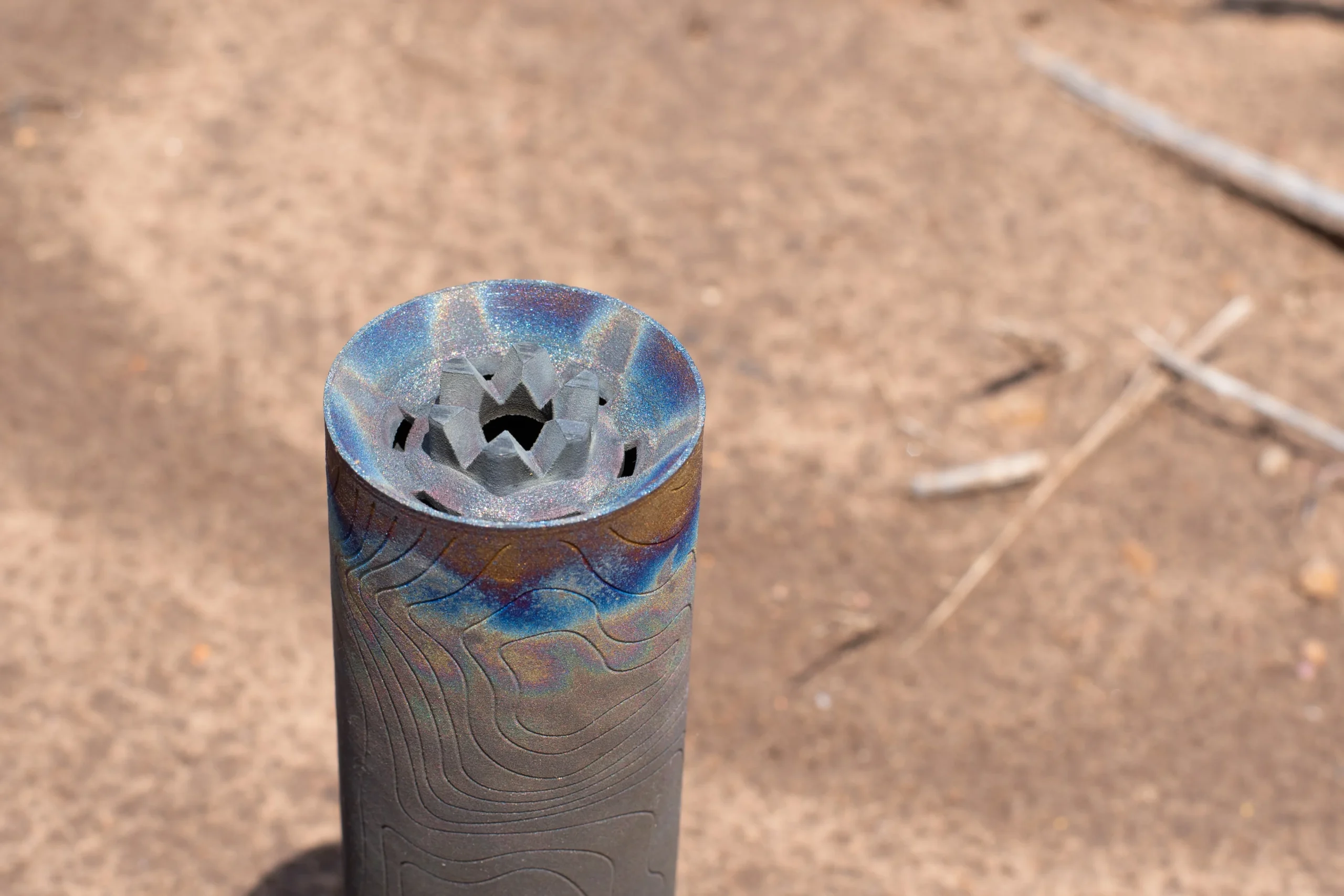 3D printed titanium suppressor with heat coloring, printed for Tidal Tactical